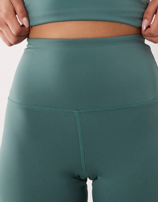 4505 Hourglass Icon active high waist 5 inch legging short with zip phone pocket in sage, 2 of 5