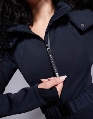ASOS 4505 Hourglass ski belted ski suit with slim kick leg and faux fur hood in black