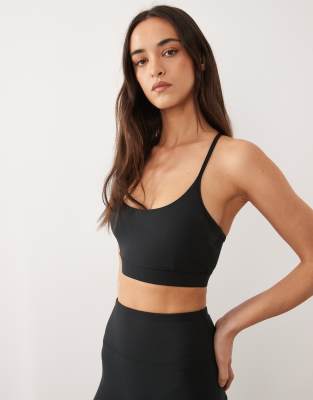 Icon - Brassière de sport maintien léger en tissu doux à bretelles réglables - Noir 34