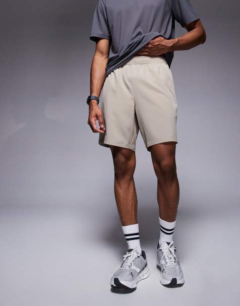 4505 – Icon – Ljusbeige, snabbtorkande träningsshorts med dragkedjefickor och 18 cm benlängd - view 1