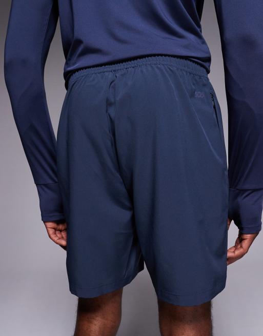 4505 – Icon – Marinblå, snabbtorkande träningsshorts med dragkedjefickor, 7 tum, 4 av 5