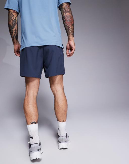 4505 – Icon – Marinblå, snabbtorkande träningsshorts med dragkedjefickor och 13 cm benlängd, 2 av 5