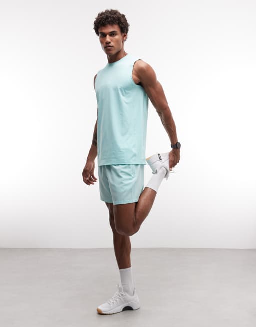 4505 - Icon - Pantalones cortos de 13 cm verde menta con bolsillos con cremallera de tejido de secado rápido, 2 de 5
