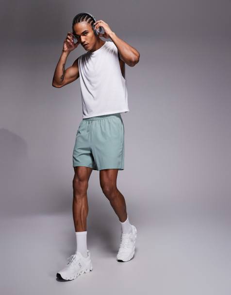 4505 Icon - Sneldrogende 5 inch trainingsshort met ritszakken in groen - view 1