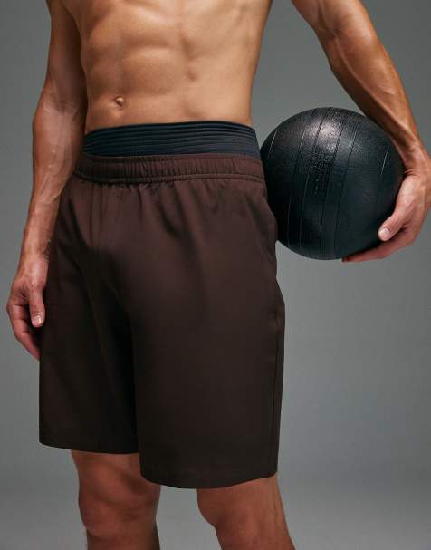 4505 - Icon - Sneldrogende trainingsshort van 13 cm met ritszakken in bruin - view 1