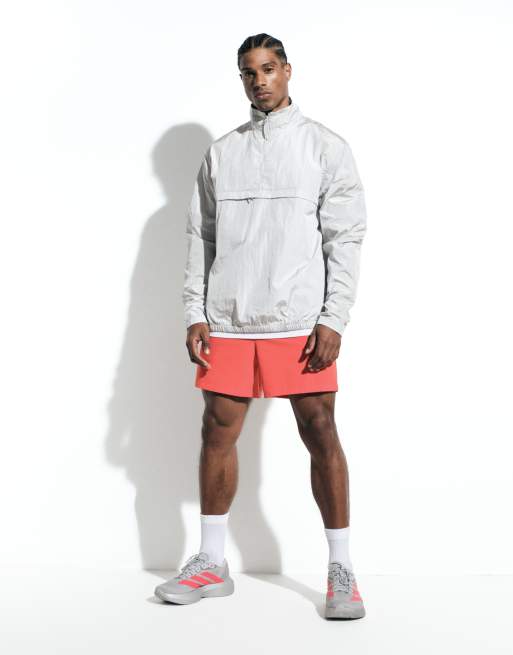 4505 - Icon - Sneldrogende trainingsshort van 5 inch met ritszakken in tomatenrood, 2 van 6