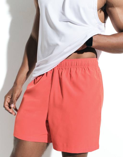 4505 - Icon - Sneldrogende trainingsshort van 5 inch met ritszakken in tomatenrood, 5 van 6