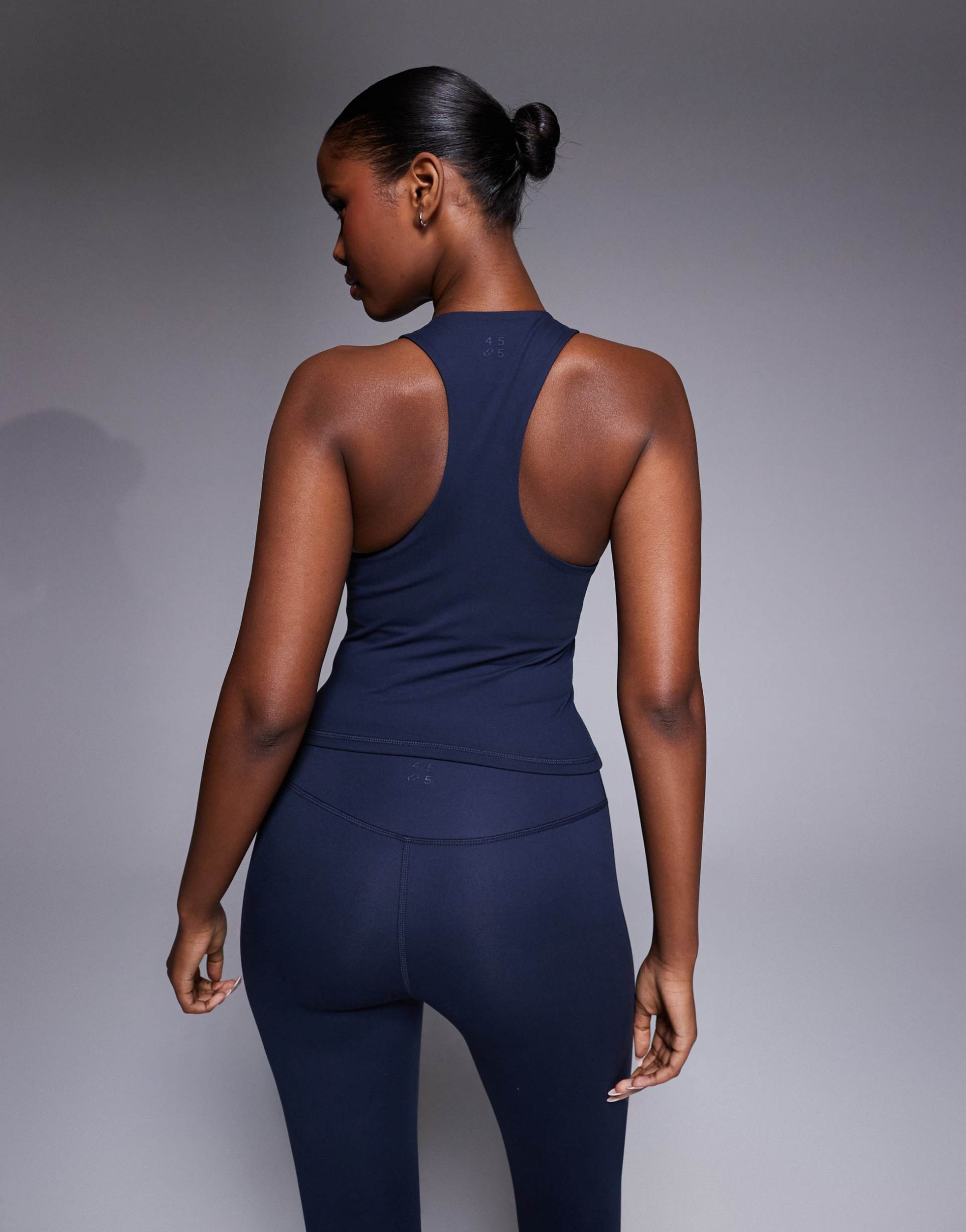 4505 icon soft touch racer back tank top with shelf bra and removable padding in midnight navy