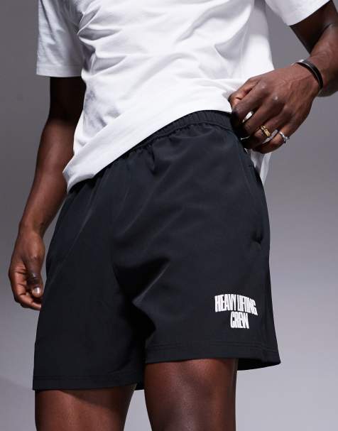 4505 - Pantaloncini sportivi neri a fondo ampio in tessuto quick dry da 18 cm con rovescio a ricci e tasche con zip - view 1