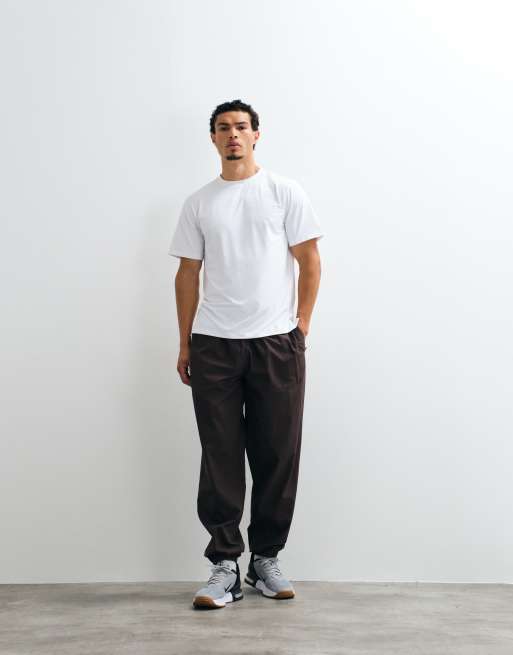 4505 - Pantaloni da allenamento ampi in cotone ripstop marroni con polsini e tasche con zip, 3 di 5