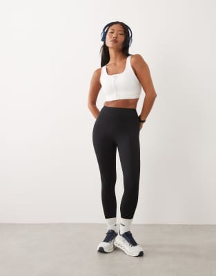 Petite - Icon - Lauf-Leggings in Schwarz mit Handytasche und Taillenschnürung Schwarz 40
