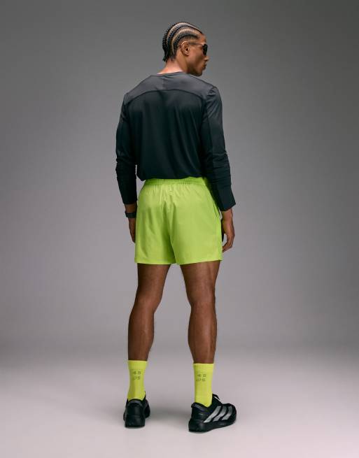 4505 Premium 3 inch woven running short with zip pockets and bonded hem in lime, 4 of 5