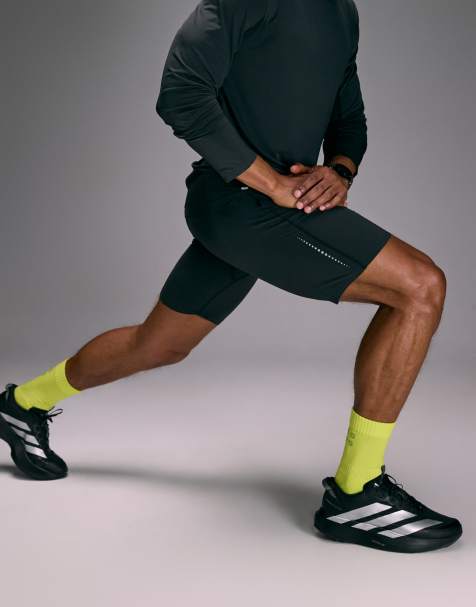 4505 Premium reflective running half tight with phone pocket and bonded hem in void black