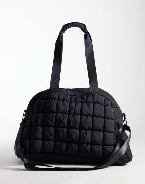 4505 puffy quilted bowler bag with external pocket and trainer compartment in black - view 1