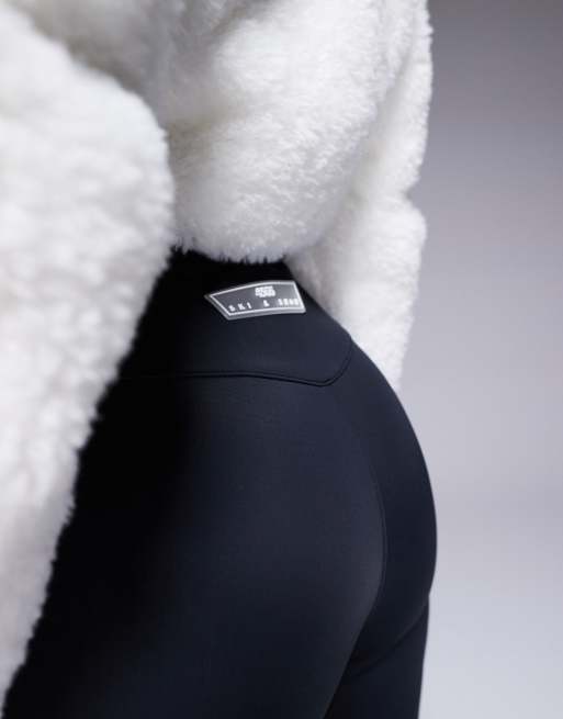 ASOS 4505 Ski suit with faux fur panels and skinny leg in black and white