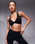 [ASOS] 4505 soft touch light support twist front sports bra in black XS Black