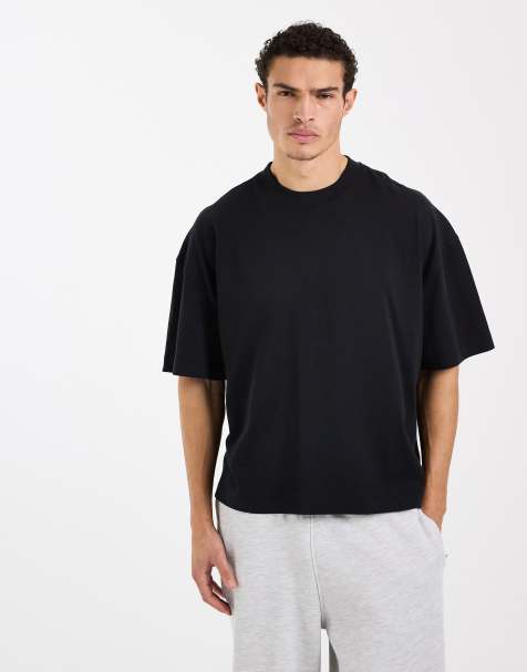4505 – Svart, kraftig, snabbtorkande t-shirt i oversize med boxig passform och sänkt axelsöm av bomull - view 1
