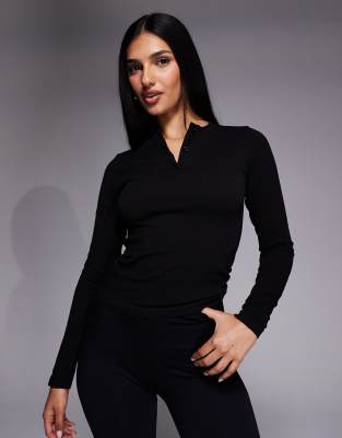 Top côtelé sans coutures à séchage rapide avec col boutonné et manches longues - Noir S