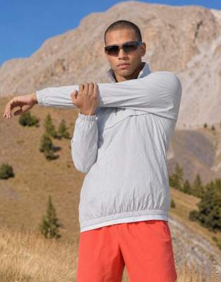 4505 Ultra Lightweight Water Repellent 1/4 Zip Running Windbreaker With Front Pocket In Silver