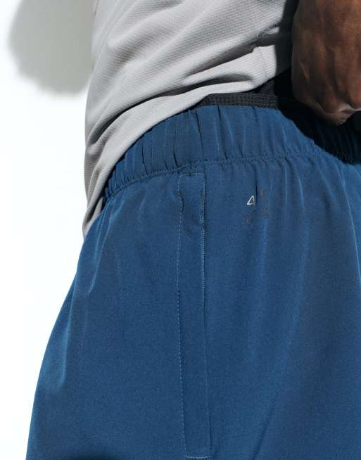 4505 - Vævede og hurtigttørrende mørkeblå 2-i-1 shorts på 13 cm med lynlåslommer, 4 af 5
