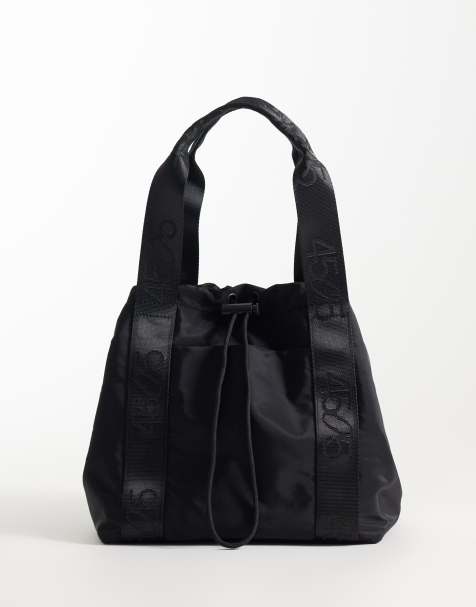 4505 woven adjustable drawstring bucket bag with external pocket in black - view 1