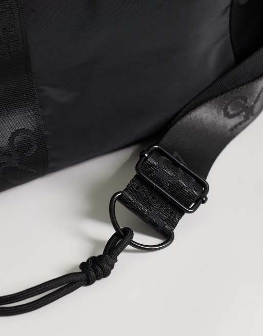 4505 woven adjustable drawstring bucket bag with external pocket in black, 3 of 4