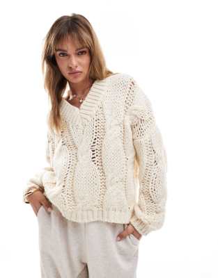 cable knit V-neck sweater in cream-White