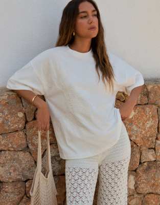 4th & Reckless x Luana Barron – Vit, oversized t-shirt i bomull med broderad sol - view 1