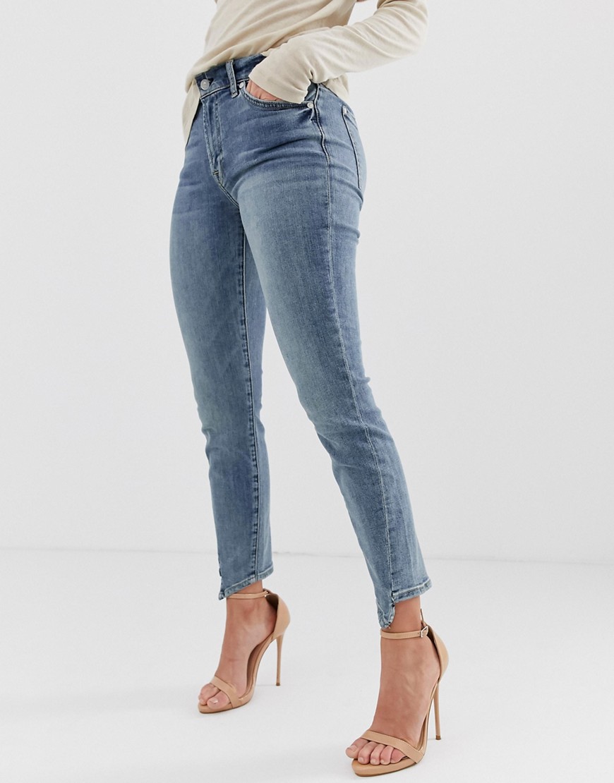 7 For All Mankind – Ankellånga skinny jeans med asymmetriskt skuren fåll-Blå