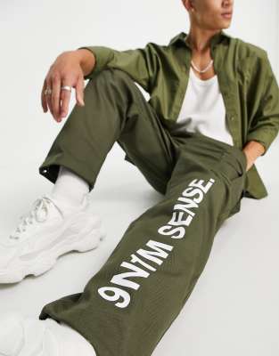 9N1M SENSE cargo trousers in khaki with logo print - ASOS Price Checker
