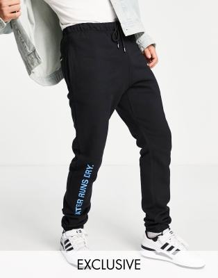 9N1M SENSE - Exclusivité ASOS - Pantalon d'ensemble de jogging à imprimé « Cold As Ice » - Noir
