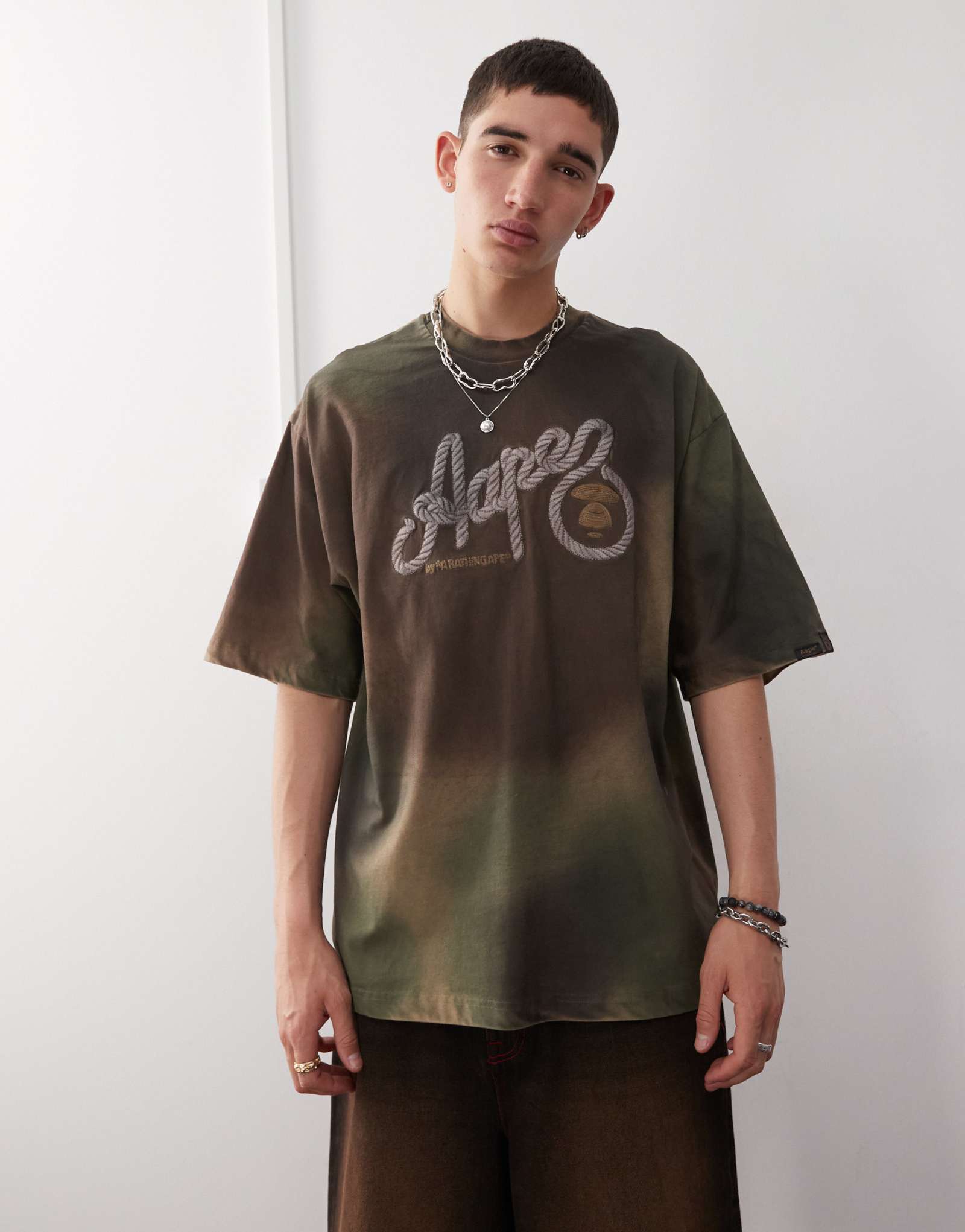 Камуфляжная футболка Aape By A Bathing Ape зеленого цвета