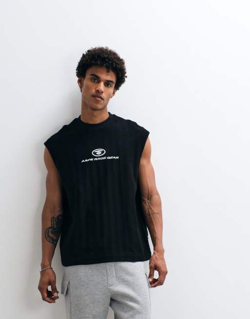 AAPE BY A BATHING APE - chaleco sin mangas de corte holgado en negro lavado con inserto de logotipo, 1 de 5