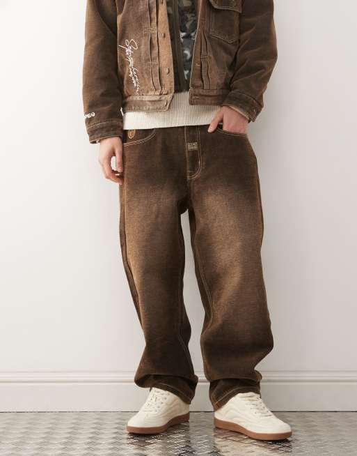 Aape by A Bathing Ape - Coordinato in denim con giacca con cappuccio imbottito mimetico e jeans multicolore