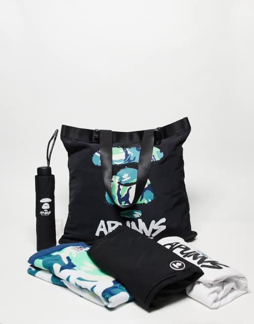 AAPE By A Bathing Ape Happy Bag Tasche in Schwarz und WeiB mit verschiedenen Produkten ASOS