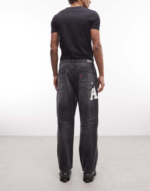 AAPE by A Bathing Ape - Jeans ampi nero slavato con stampa del logo, 3 di 5