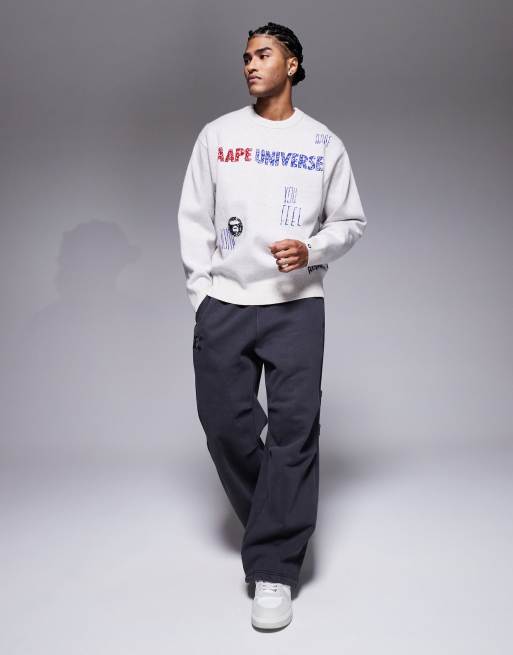 Aape by A Bathing Ape knitted sweater in off white with placement scribble print