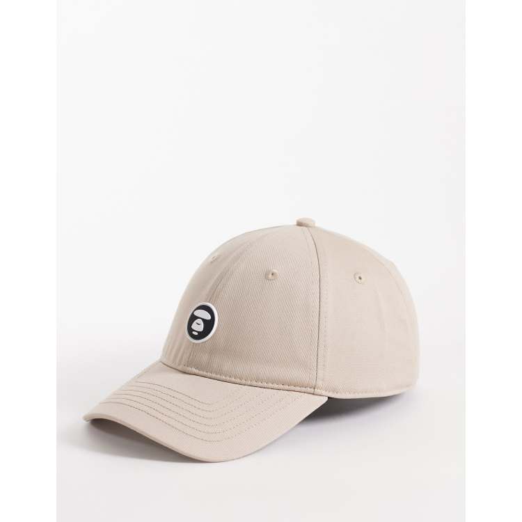 Aape by A Bathing Ape logo baseball cap in beige | ASOS