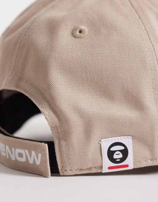 Aape by A Bathing Ape logo baseball cap in beige | ASOS