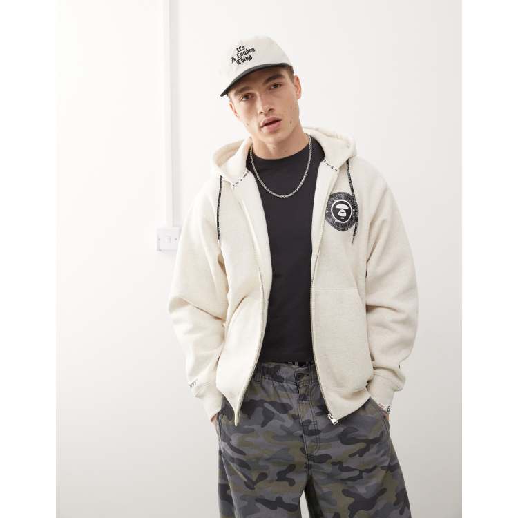 Aape by A Bathing Ape logo zip up hoodie in beige | ASOS