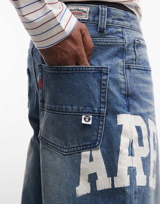Aape by A Bathing Ape loose fit denim jorts in washed blue with logo print, 4 of 5