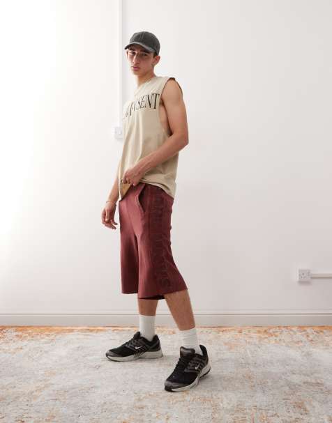 Aape by A Bathing Ape loose fit heavyweight knitted shorts in dark burgundy with embroidered side stripe - view 1