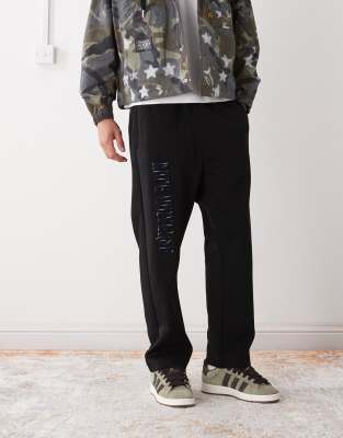 AAPE BY A BATHING APE® Aape by A Bathing Ape loose fit joggers in black with leg embroidery