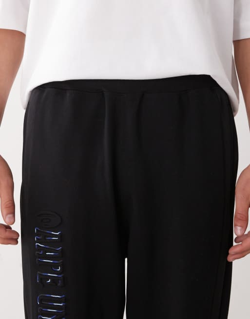 Aape by A Bathing Ape loose fit joggers in black with leg embroidery, 5 of 5