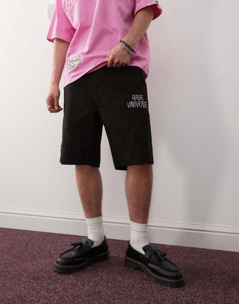 Aape by A Bathing Ape loose fit shorts in black with all-over logo print - view 1