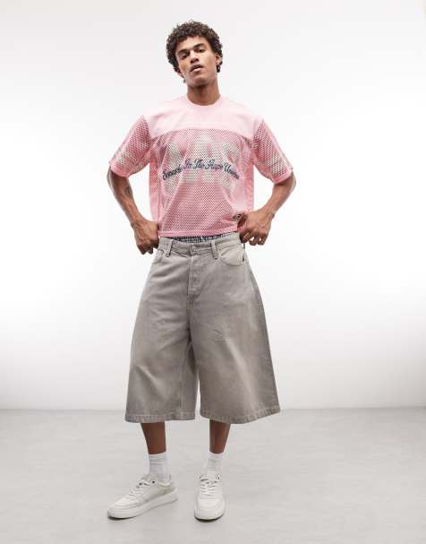 Aape by A Bathing Ape oversized mesh jersey top in pink with multi logo prints - view 1