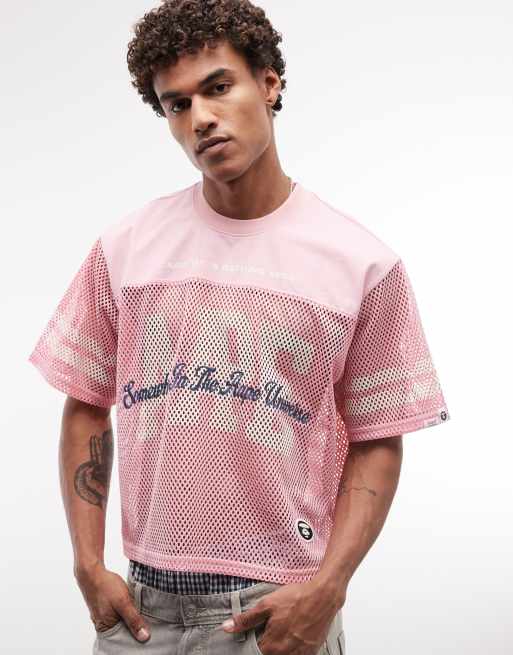 Aape by A Bathing Ape oversized mesh jersey top in pink with multi logo prints, 3 of 5