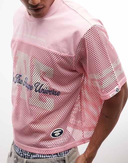 Aape by A Bathing Ape oversized mesh jersey top in pink with multi logo prints, 4 of 5