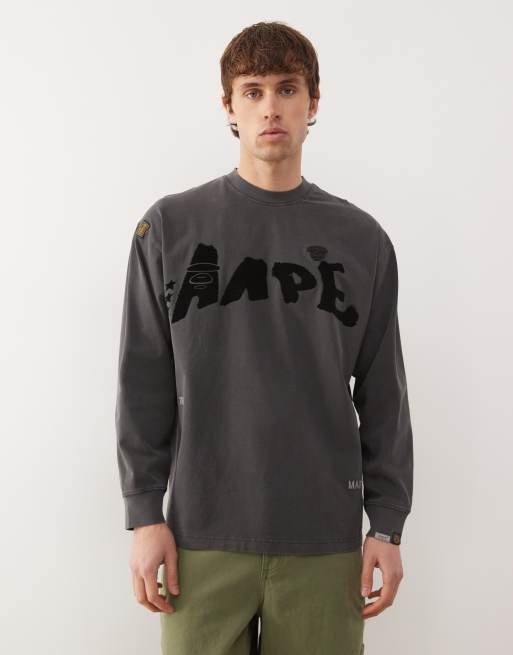 Aape By A Bathing Ape - Oversized T-shirt med lange ærmer i sort vask med graffitiprint