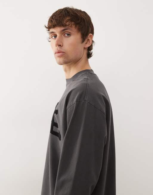 Aape By A Bathing Ape - Oversized T-shirt med lange ærmer i sort vask med graffitiprint, 4 af 5